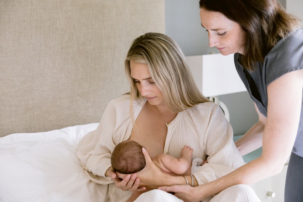 A mother receiving lactation support during a postpartum stay at Cassiana